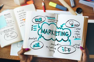 figure_photo: Notizbuch mit Marketingplanung darin